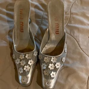 Miu Miu mules. Silver with embossed flowers